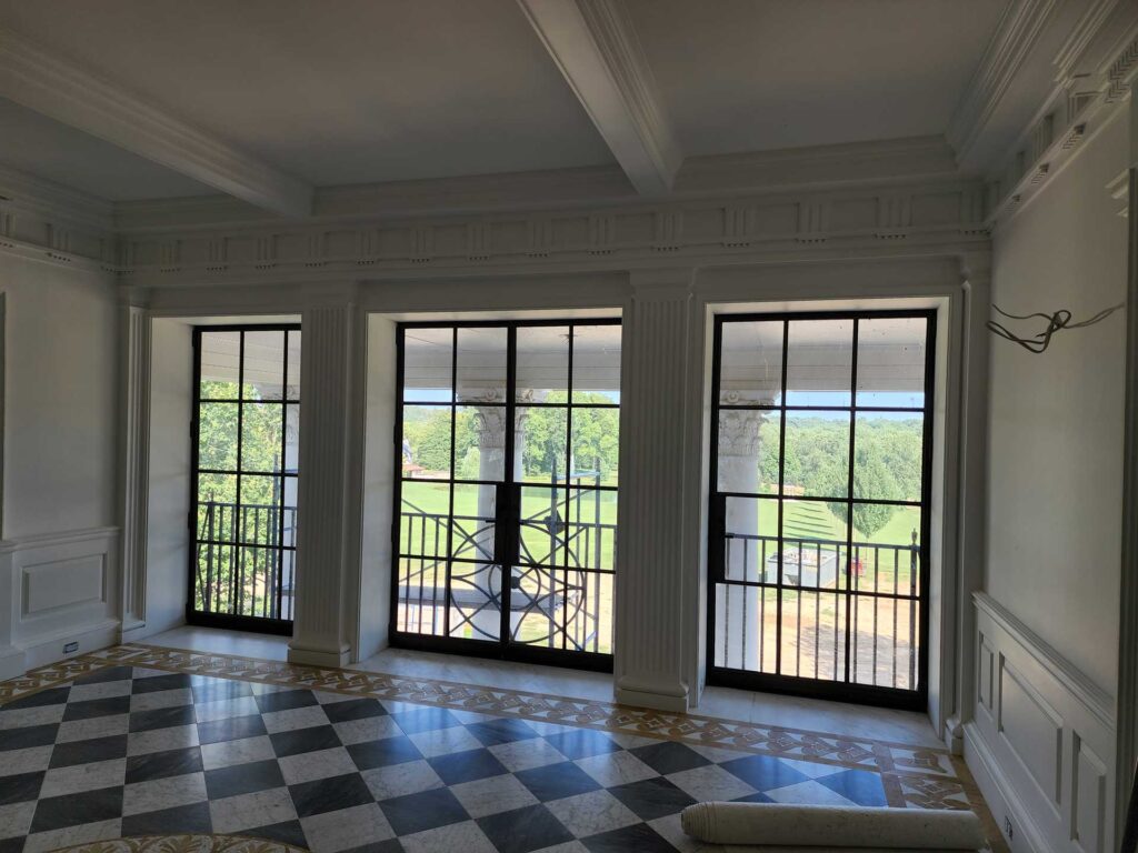 Bronze doors in a Greek revival-style property